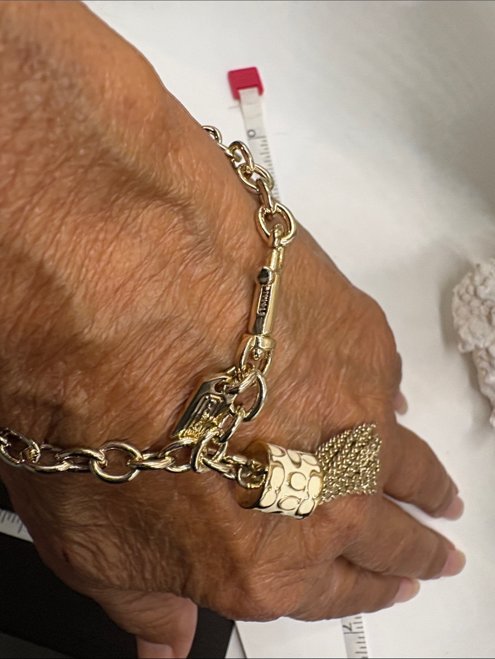 Coach Gold Chain Bracelet with Tassel Charm